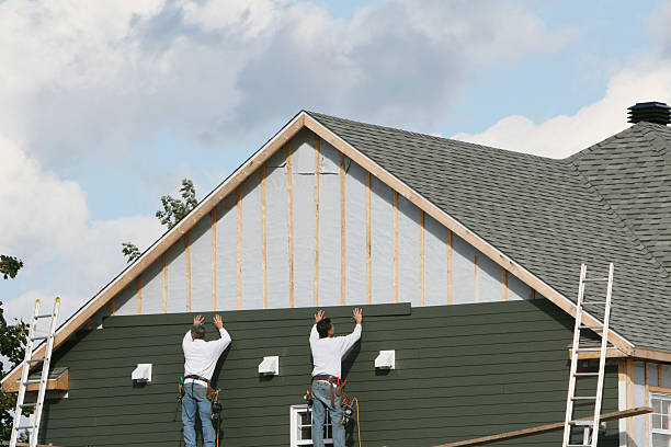 Professional Siding technician working in Vass, NC